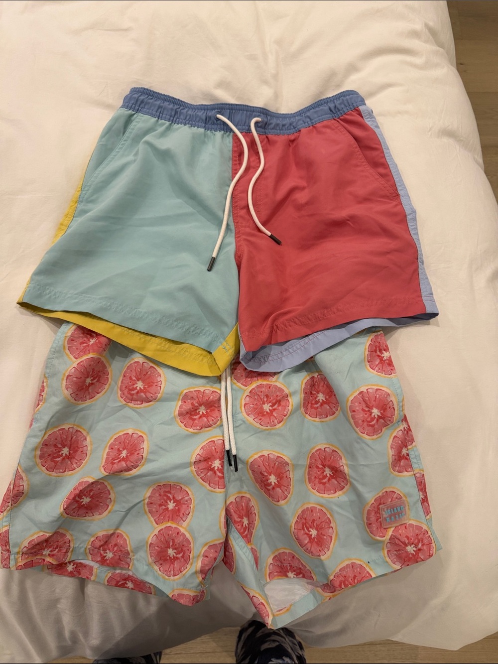 Light Blue Swim Shorts with Pink Grapefruit Print and colour block swim shorts